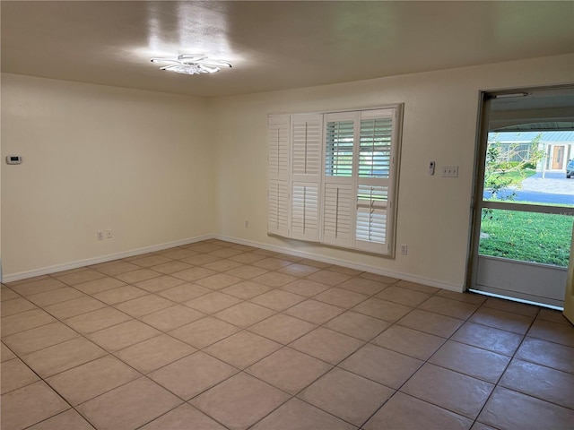 4424 Coco Ridge Cir, Sarasota, FL 34233 - empty room featuring plenty of natural light and light tile patterned floors