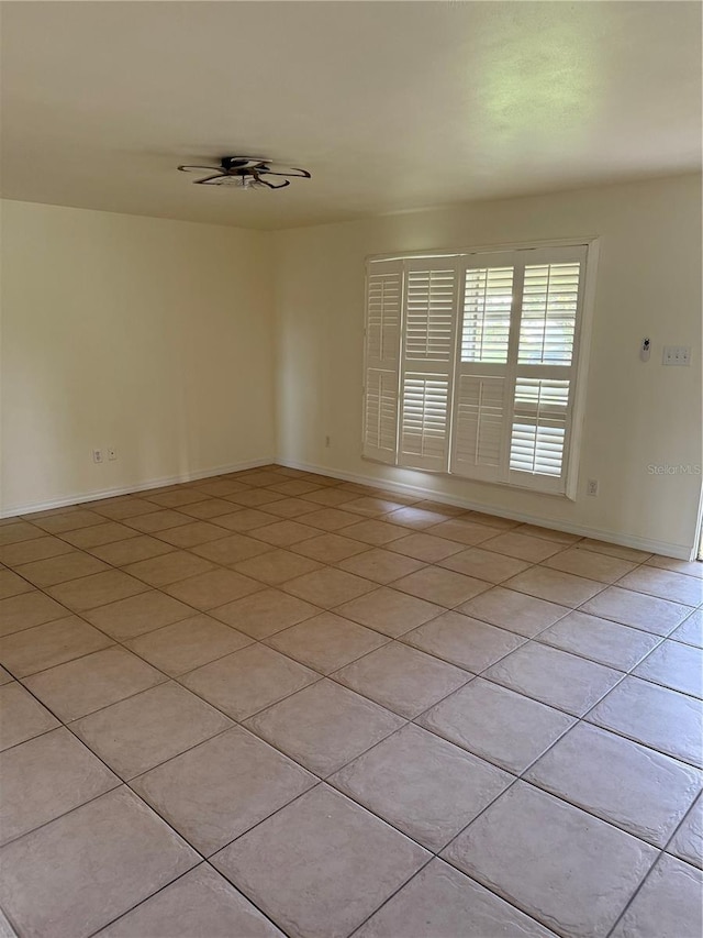 4424 Coco Ridge Cir, Sarasota, FL 34233 - unfurnished room featuring light tile patterned floors and a ceiling fan
