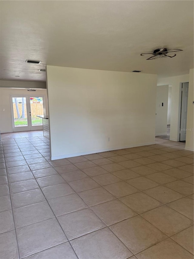 4424 Coco Ridge Cir, Sarasota, FL 34233 - unfurnished room featuring light tile patterned floors, french doors, and a ceiling fan