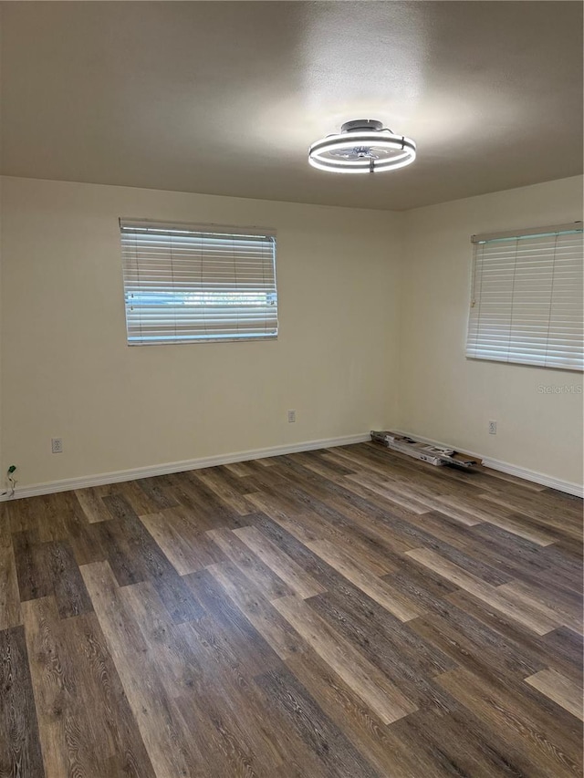 4424 Coco Ridge Cir, Sarasota, FL 34233 - unfurnished room with dark wood-style flooring