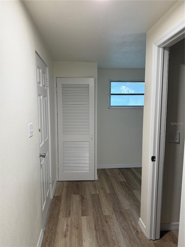 4424 Coco Ridge Cir, Sarasota, FL 34233 - corridor featuring wood finished floors