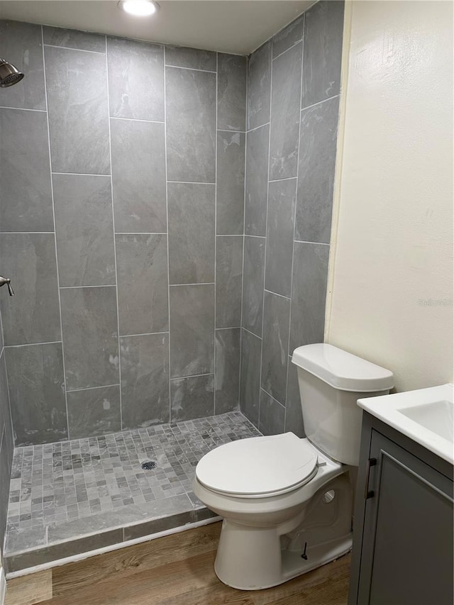 4424 Coco Ridge Cir, Sarasota, FL 34233 - full bath with vanity, wood finished floors, and a stall shower