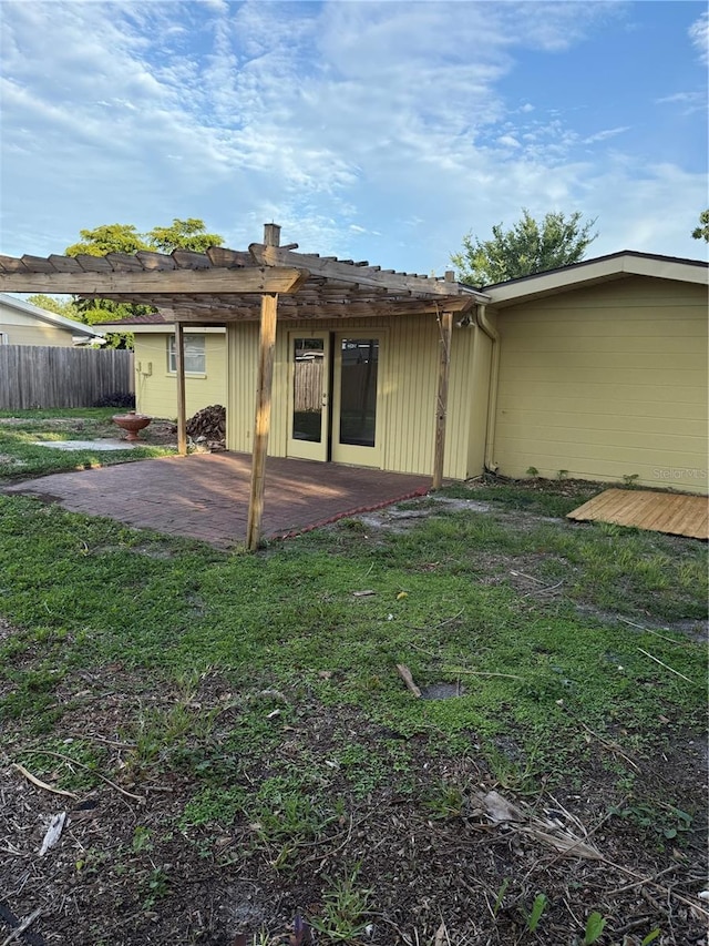 4424 Coco Ridge Cir, Sarasota, FL 34233 - rear view of house with a pergola and a patio
