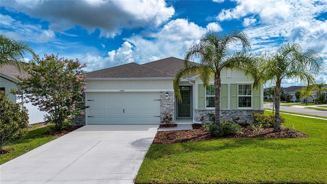 13829 Camden Crest Ter, Bradenton, FL 34211 - ranch-style home featuring stone siding, a garage, a front lawn, and concrete driveway