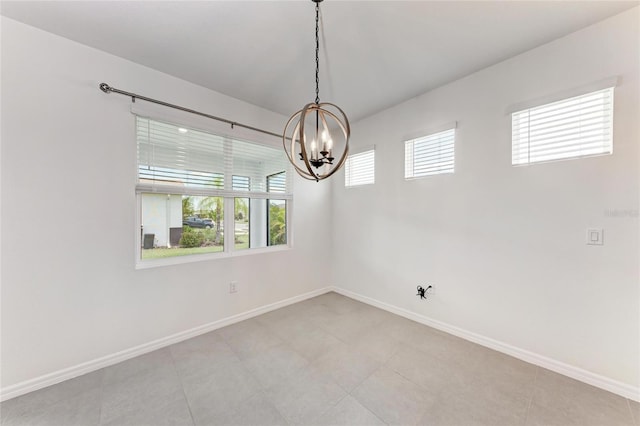 13829 Camden Crest Ter, Bradenton, FL 34211 - spare room with a chandelier and baseboards