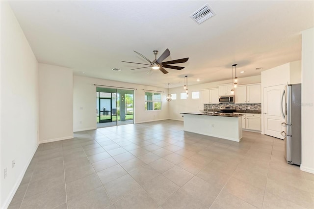13829 Camden Crest Ter, Bradenton, FL 34211 - unfurnished living room featuring ceiling fan and light tile patterned flooring