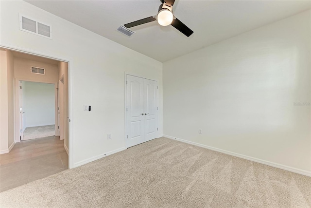 13829 Camden Crest Ter, Bradenton, FL 34211 - unfurnished bedroom with light carpet, a closet, and a ceiling fan