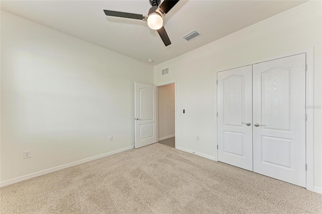 13829 Camden Crest Ter, Bradenton, FL 34211 - unfurnished bedroom with carpet, a closet, and a ceiling fan