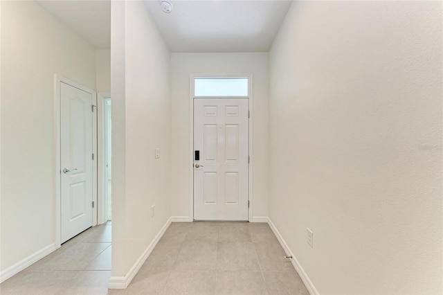 13829 Camden Crest Ter, Bradenton, FL 34211 - doorway featuring baseboards and light tile patterned flooring