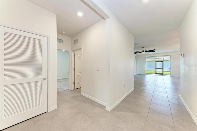 13829 Camden Crest Ter, Bradenton, FL 34211 - hall featuring light tile patterned floors and baseboards