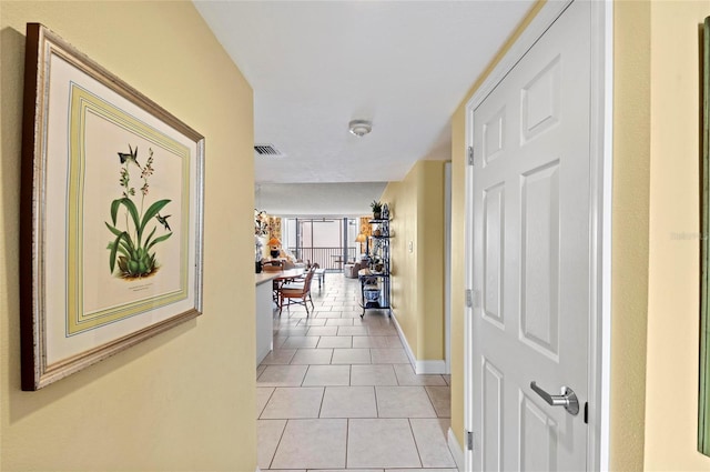 6480 Midnight Pass Rd Unit 503, Sarasota, FL 34242 - corridor featuring light tile patterned flooring and baseboards