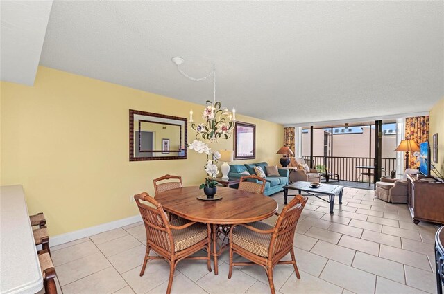 6480 Midnight Pass Rd Unit 503, Sarasota, FL 34242 - dining space featuring a chandelier and light tile patterned floors