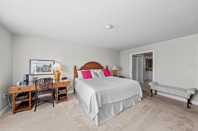 6480 Midnight Pass Rd Unit 503, Sarasota, FL 34242 - carpeted bedroom with a textured ceiling and ensuite bath