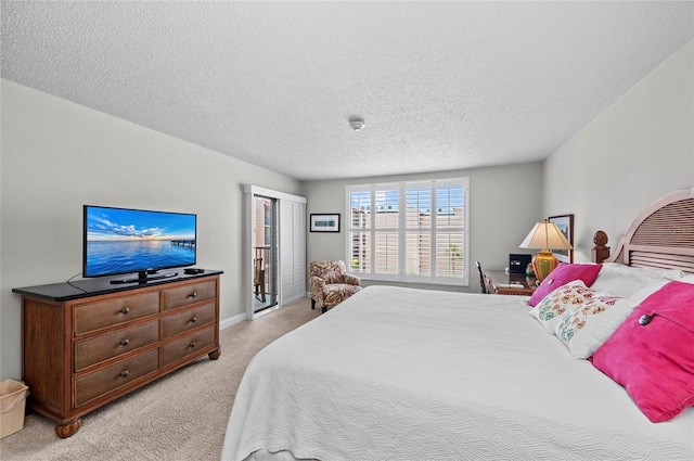 6480 Midnight Pass Rd Unit 503, Sarasota, FL 34242 - bedroom with light carpet and a textured ceiling