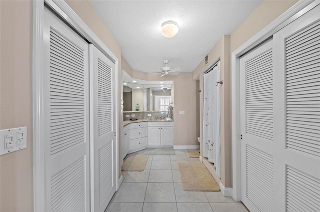 6480 Midnight Pass Rd Unit 503, Sarasota, FL 34242 - hallway featuring light tile patterned floors and baseboards