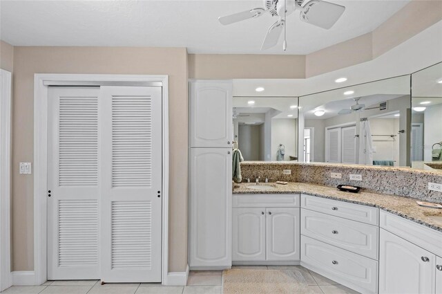 6480 Midnight Pass Rd Unit 503, Sarasota, FL 34242 - bathroom featuring ceiling fan, tile patterned floors, a closet, and double vanity