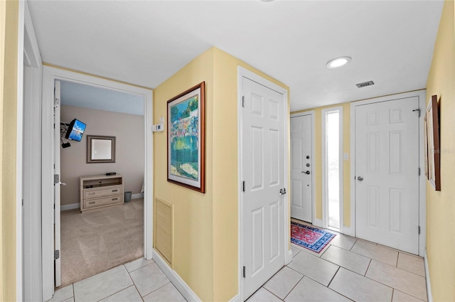 6480 Midnight Pass Rd Unit 503, Sarasota, FL 34242 - entryway featuring light tile patterned floors and light colored carpet