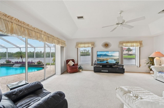 4173 Beach View Ct, Port Charlotte, FL 33948 - carpeted living area featuring a ceiling fan, a sunroom, and vaulted ceiling