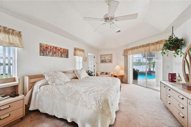 4173 Beach View Ct, Port Charlotte, FL 33948 - bedroom with access to exterior, light colored carpet, a raised ceiling, and a ceiling fan