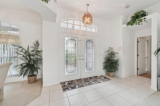 4173 Beach View Ct, Port Charlotte, FL 33948 - tiled entrance foyer featuring a chandelier and french doors