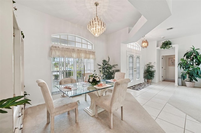 4173 Beach View Ct, Port Charlotte, FL 33948 - dining space featuring a chandelier, a high ceiling, and light tile patterned floors