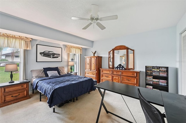 4173 Beach View Ct, Port Charlotte, FL 33948 - bedroom with light colored carpet, multiple windows, ceiling fan, and a desk