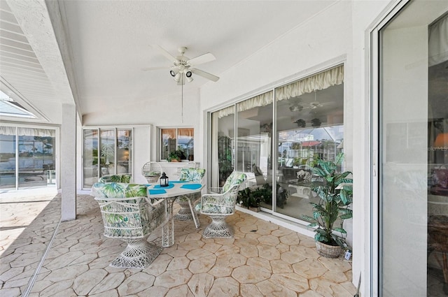 4173 Beach View Ct, Port Charlotte, FL 33948 - sunroom / solarium featuring ceiling fan, outdoor dining space, and stone finish floors