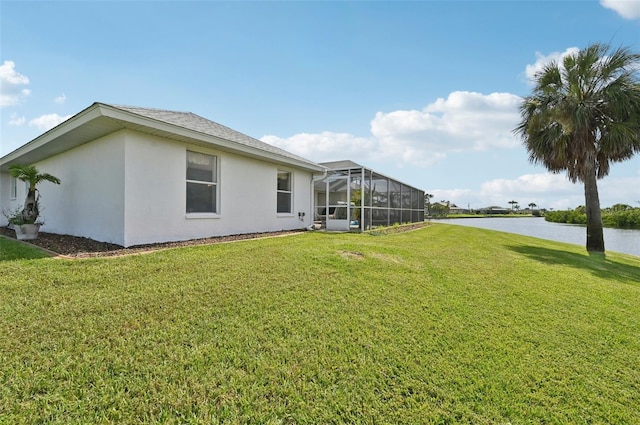4173 Beach View Ct, Port Charlotte, FL 33948 - view of green lawn with a water view and glass enclosure