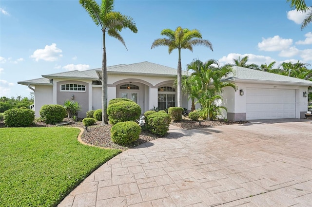 4173 Beach View Ct, Port Charlotte, FL 33948 - single story home featuring a front yard, decorative driveway, stucco siding, and a garage