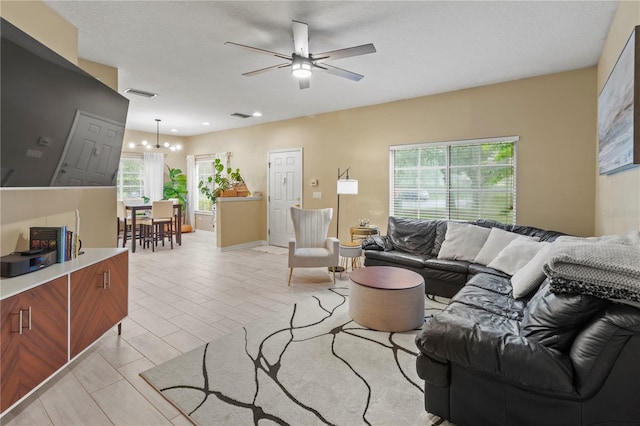 311 Cape Harbour Loop Unit 101, Bradenton, FL 34212 - living area with ceiling fan and a chandelier