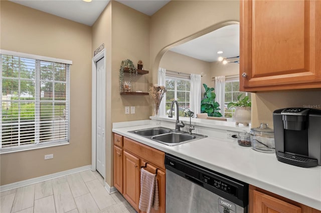 311 Cape Harbour Loop Unit 101, Bradenton, FL 34212 - kitchen featuring dishwasher, light countertops, arched walkways, open shelves, and brown cabinets