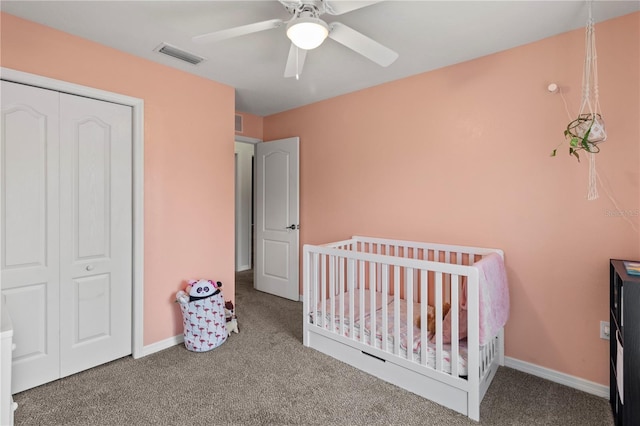 311 Cape Harbour Loop Unit 101, Bradenton, FL 34212 - carpeted bedroom featuring a closet, a ceiling fan, and a nursery area