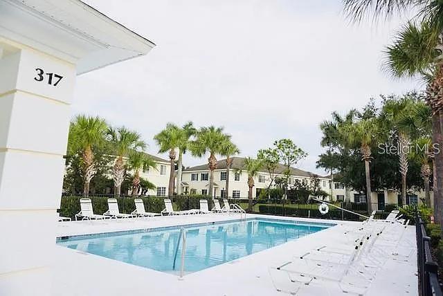 311 Cape Harbour Loop Unit 101, Bradenton, FL 34212 - community pool with a patio area