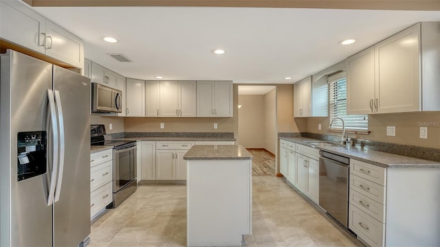 8103 11th Ave NW, Bradenton, FL 34209 - kitchen with stainless steel appliances, a center island, and recessed lighting