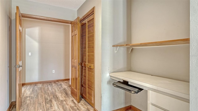 8103 11th Ave NW, Bradenton, FL 34209 - hall featuring light wood-style floors and baseboards