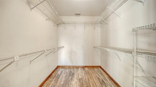 8103 11th Ave NW, Bradenton, FL 34209 - spacious closet featuring light wood finished floors