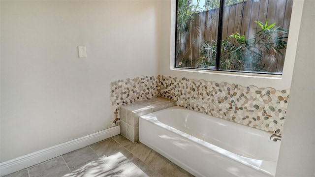 8103 11th Ave NW, Bradenton, FL 34209 - bathroom with a bath and baseboards