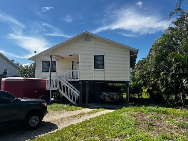 5564 Birdsong Ln, Bokeelia, FL 33922 - photo 1