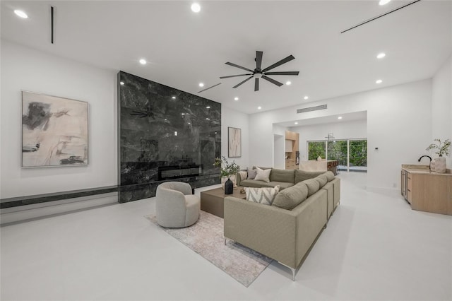 3500 Bay Shore Rd, Sarasota, FL 34234 - living room with a ceiling fan, recessed lighting, and concrete floors