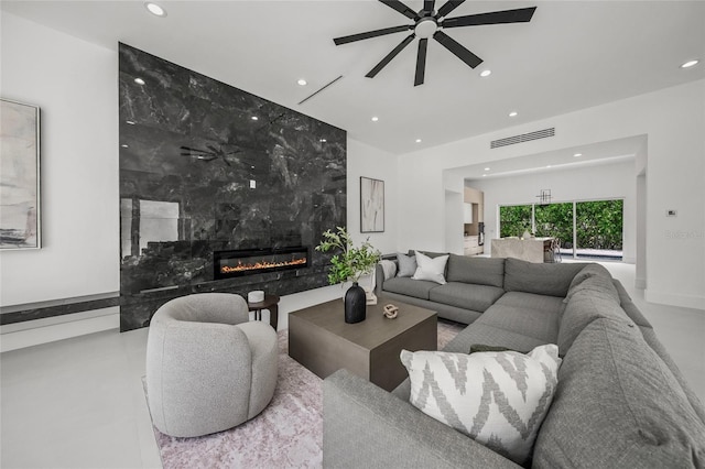 3500 Bay Shore Rd, Sarasota, FL 34234 - living room featuring recessed lighting, a premium fireplace, and ceiling fan