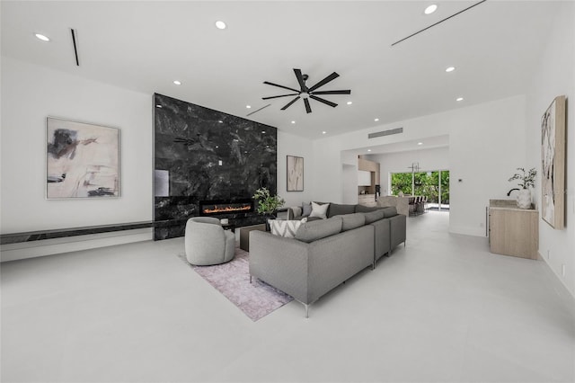 3500 Bay Shore Rd, Sarasota, FL 34234 - living area featuring recessed lighting, finished concrete flooring, ceiling fan, and a high end fireplace