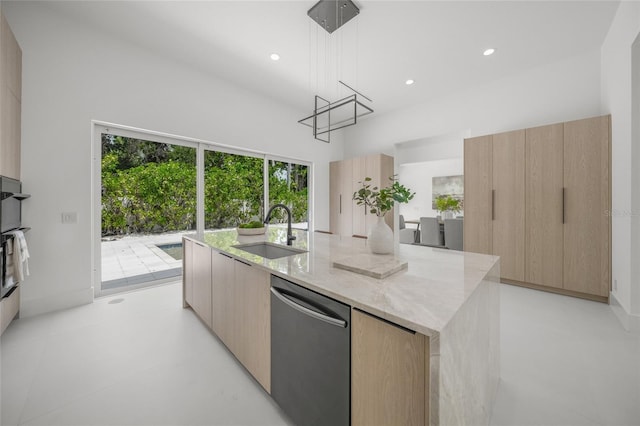 3500 Bay Shore Rd, Sarasota, FL 34234 - kitchen featuring dishwasher, modern cabinets, a kitchen island with sink, light stone counters, and light brown cabinets