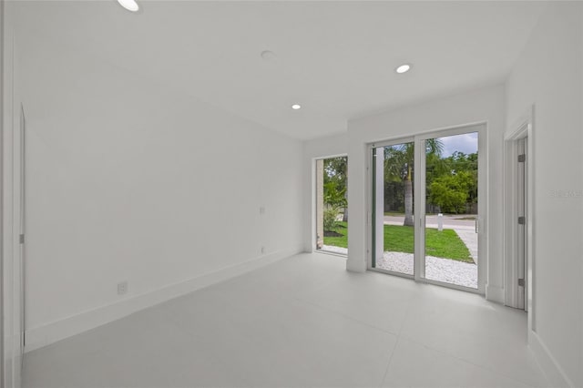 3500 Bay Shore Rd, Sarasota, FL 34234 - empty room featuring light tile patterned flooring and recessed lighting