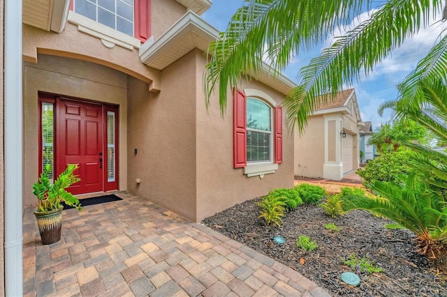 6305 Golden Eye Gln, Lakewood Ranch, FL 34202 - view of exterior entry featuring stucco siding