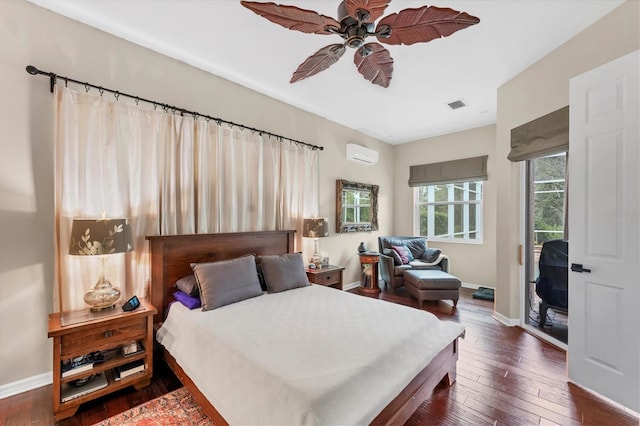 6305 Golden Eye Gln, Lakewood Ranch, FL 34202 - bedroom with an AC wall unit, dark wood-style flooring, access to outside, and a ceiling fan