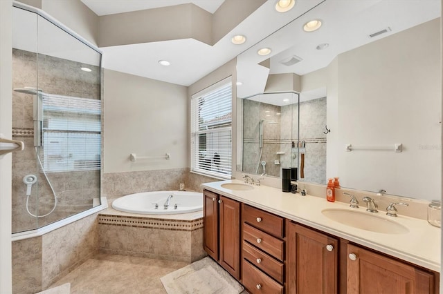 6305 Golden Eye Gln, Lakewood Ranch, FL 34202 - bathroom featuring a garden tub, a tile shower, double vanity, tile patterned floors, and recessed lighting