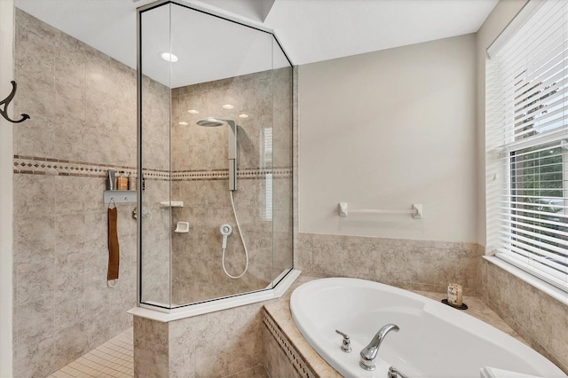 6305 Golden Eye Gln, Lakewood Ranch, FL 34202 - full bath featuring a bath, walk in shower, and plenty of natural light