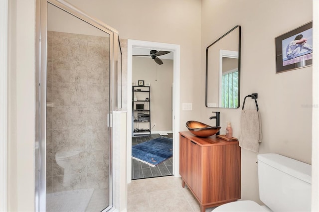 6305 Golden Eye Gln, Lakewood Ranch, FL 34202 - bathroom featuring tile patterned flooring, a shower stall, a ceiling fan, and vanity