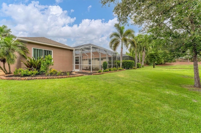 6305 Golden Eye Gln, Lakewood Ranch, FL 34202 - view of green lawn with a lanai