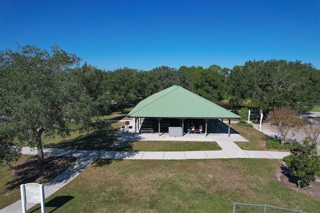 6305 Golden Eye Gln, Lakewood Ranch, FL 34202 - back of property featuring a yard and a wooded view